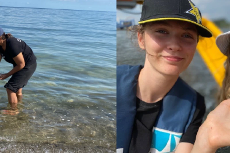 Kinder stehen im Wasser und halten einen kleinen Seestern auf der Hand 