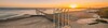 die maritim Seebrücke in Form eines Lassos im Sonnenuntergang